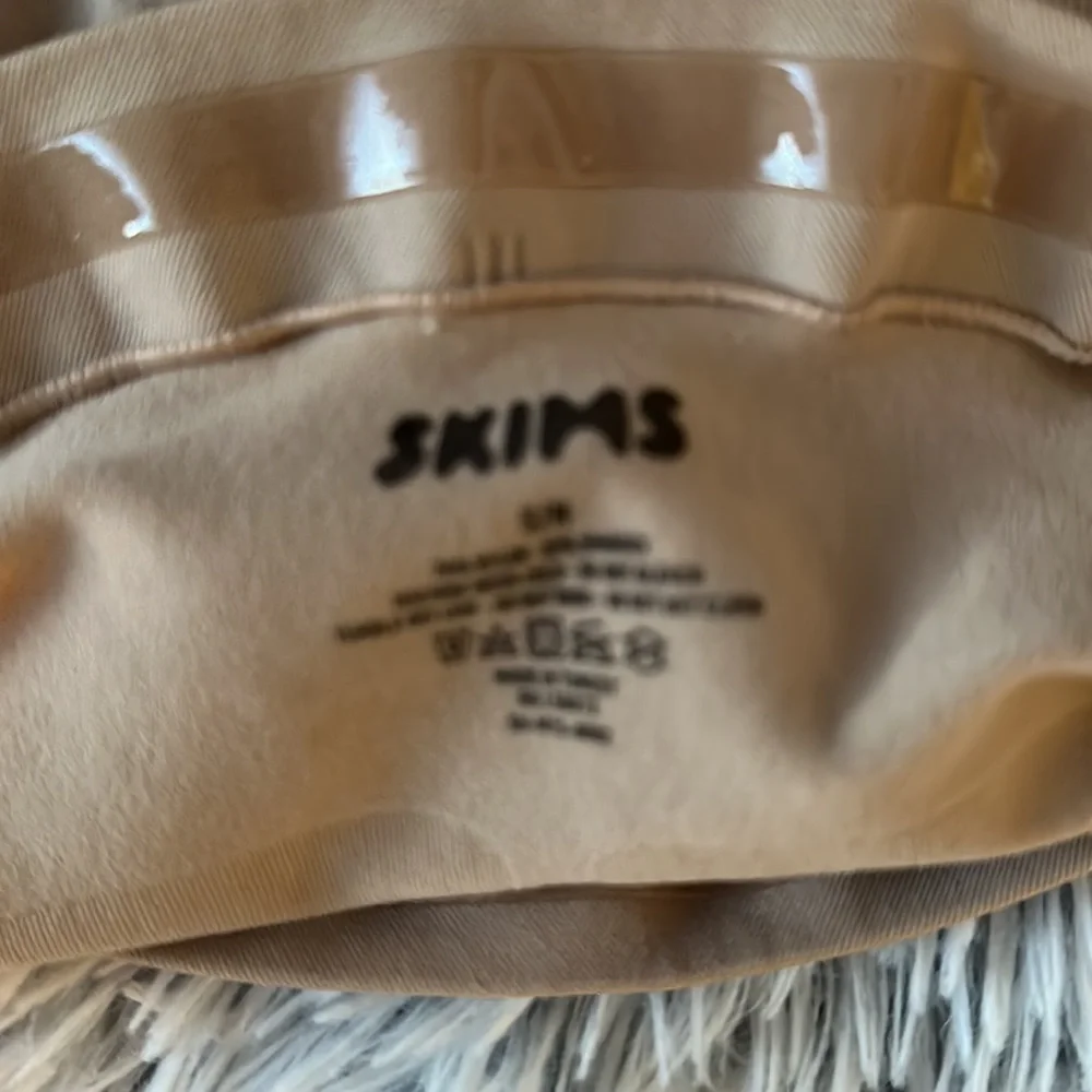 SKIMS reposhing these